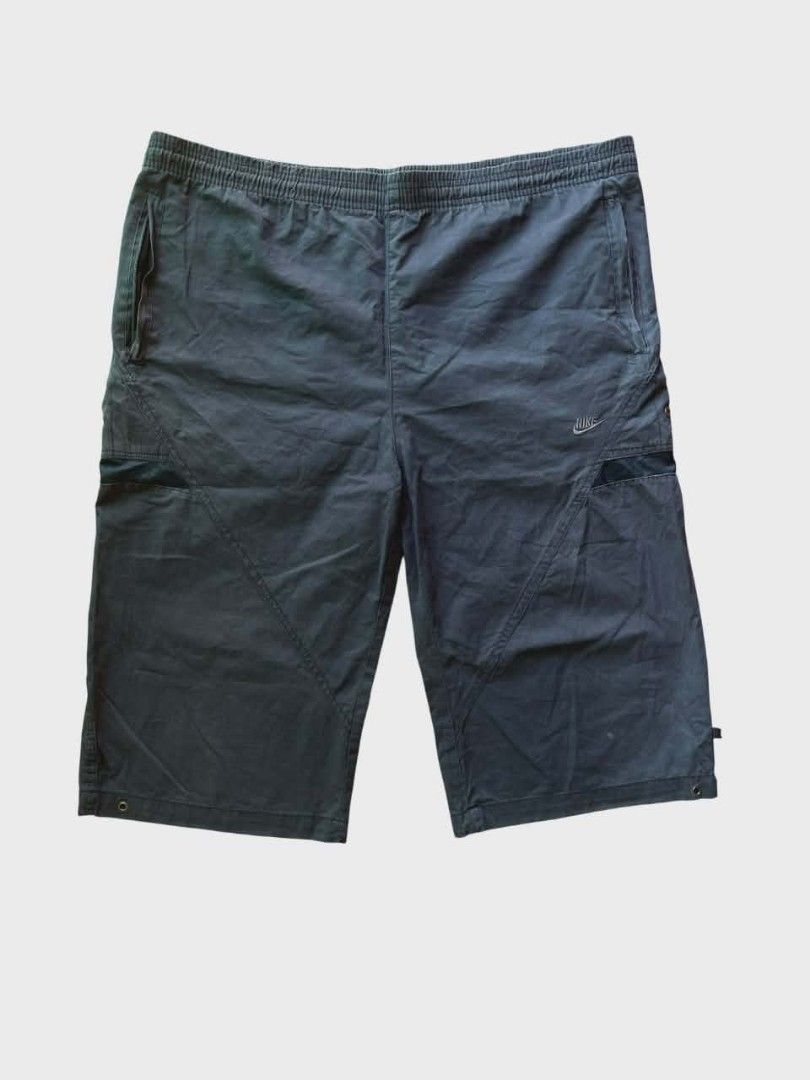 Nike Clima-Fit Shorts XXL (Category: Shorts) located in Manila. Submitted by dulthriftcollection3 (Listing ID 1424934121, Image 2). Description: Nike Clima-Fit shorts in black. Features a drawstring waist, side pockets, and a small Nike logo. The shorts have a mesh detail on the side. The size is XXL. Made in Hong Kong and Vietnam..