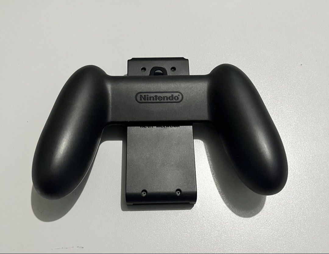 Nintendo Switch “Joycon Holder Controller” (Category: Controllers) located in Quezon City. Submitted by pwrproductions (Listing ID 1425002260, Image 2). Description: .