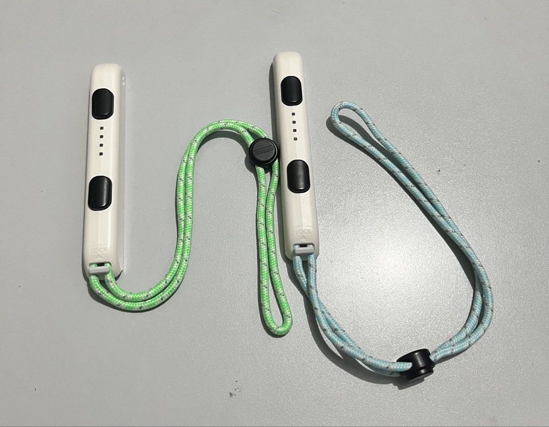 Nintendo Switch “Joycon Wrist Holder” ‘2 pieces (Category: Controllers) located in Quezon City. Submitted by pwrproductions (Listing ID 1425003031, Image 1). Description: Attachable to nintendo switch joycons.