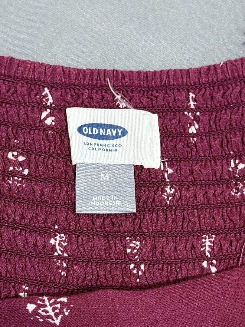 Old Navy Maroon Dress (Category: Dresses) located in Mansalay. Submitted by declutterandco (Listing ID 1424885065, Image 3). Description: Maroon dress from Old Navy. Features a floral pattern and spaghetti straps. The dress is a midi length. Size M. Made in Indonesia..