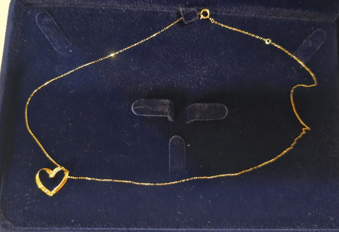 Open Heart Pendant Diamond Necklace (Category: Necklaces) located in Manila. Submitted by cher0918 (Listing ID 1424974238, Image 3). Description: - Gold chain necklace with heart-shaped diamond pendant - Includes JVC certificate of authenticity k18 japan gold - 0.05 carat - Color: G-H - Clarity: VS - Gross Weight: 0.94 grams - Comes with original box.