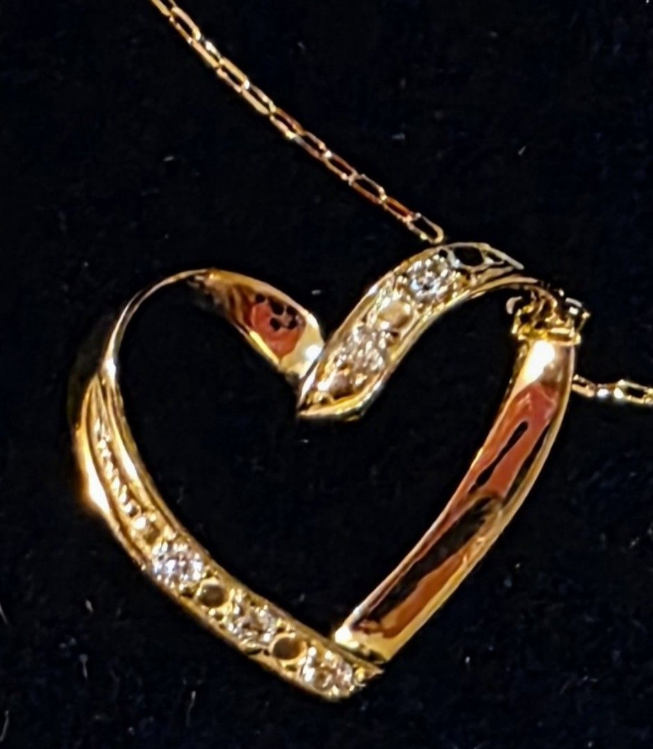 Open Heart Pendant Diamond Necklace (Category: Necklaces) located in Manila. Submitted by cher0918 (Listing ID 1424974238, Image 1). Description: - Gold chain necklace with heart-shaped diamond pendant - Includes JVC certificate of authenticity k18 japan gold - 0.05 carat - Color: G-H - Clarity: VS - Gross Weight: 0.94 grams - Comes with original box.