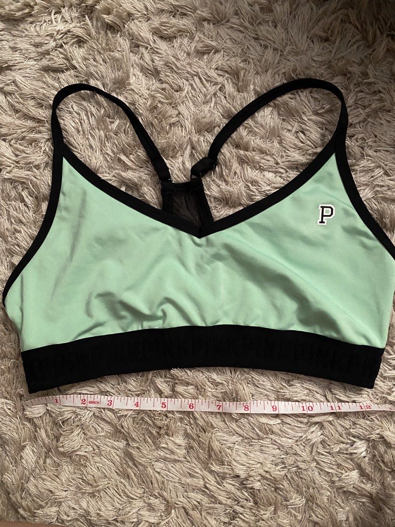 Pink Victoria's Secret Ultimate Sports Bra (Category: Activewear) located in Las Pinas. Submitted by sherylandmargaux (Listing ID 1425018710, Image 1). Description: Pink Victoria's Secret Ultimate sports bra in mint green and black. Features a racerback design with a mesh panel at the back. The bra has a black band at the bottom and a small "P" logo on the front. Size L, fits C80, D80, A85, C85. Made in Vietnam..