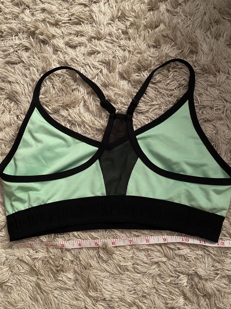 Pink Victoria's Secret Ultimate Sports Bra (Category: Activewear) located in Las Pinas. Submitted by sherylandmargaux (Listing ID 1425018710, Image 3). Description: Pink Victoria's Secret Ultimate sports bra in mint green and black. Features a racerback design with a mesh panel at the back. The bra has a black band at the bottom and a small "P" logo on the front. Size L, fits C80, D80, A85, C85. Made in Vietnam..