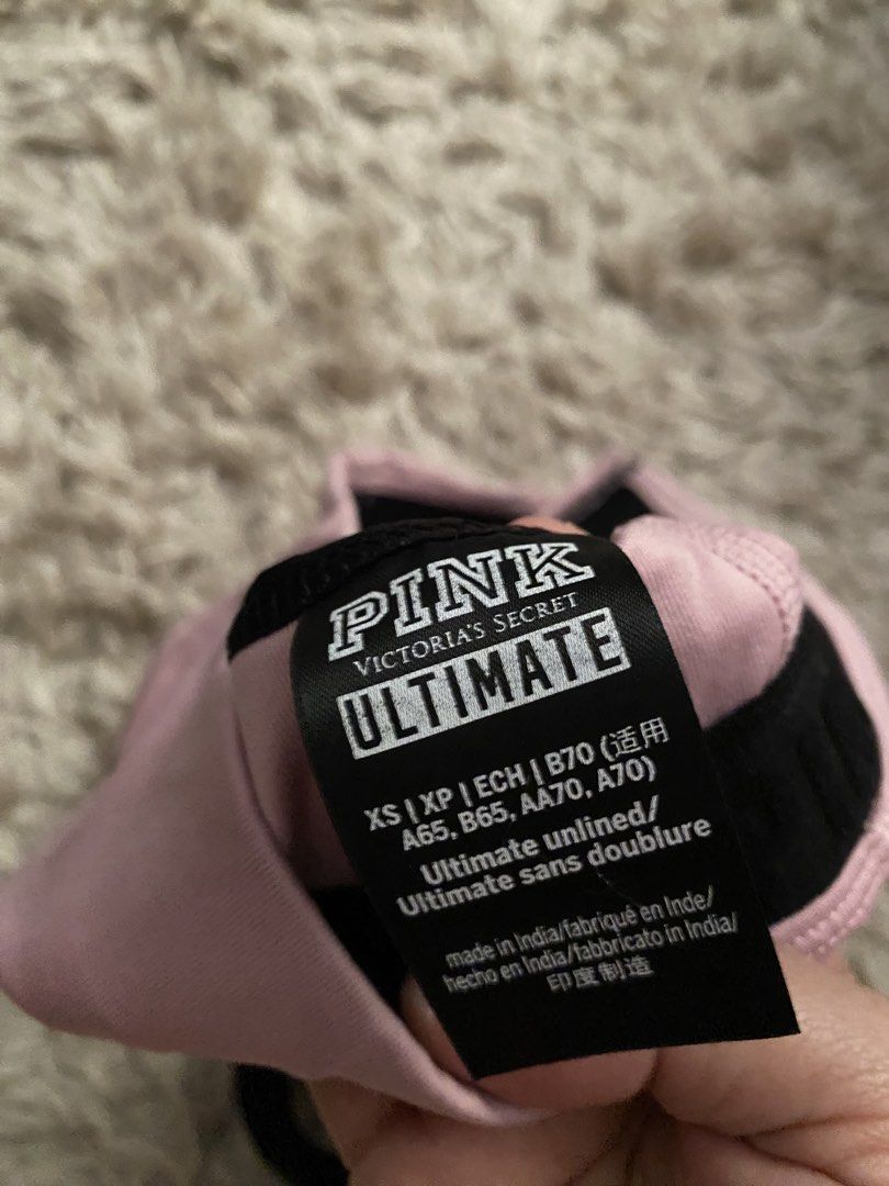 Pink Victoria's Secret Ultimate Sports Bra XS (Category: Activewear) located in Las Pinas. Submitted by sherylandmargaux (Listing ID 1425019066, Image 3). Description: Pink Victoria's Secret Ultimate sports bra in size XS. Features a front zipper with "PINK" printed on it. The bra has a pink and black color scheme with mesh detailing on the back and sides. The bra is unlined. Measurements are provided in the images..