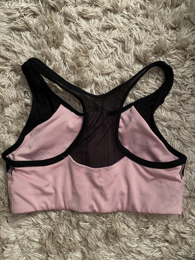 Pink Victoria's Secret Ultimate Sports Bra XS (Category: Activewear) located in Las Pinas. Submitted by sherylandmargaux (Listing ID 1425019066, Image 2). Description: Pink Victoria's Secret Ultimate sports bra in size XS. Features a front zipper with "PINK" printed on it. The bra has a pink and black color scheme with mesh detailing on the back and sides. The bra is unlined. Measurements are provided in the images..