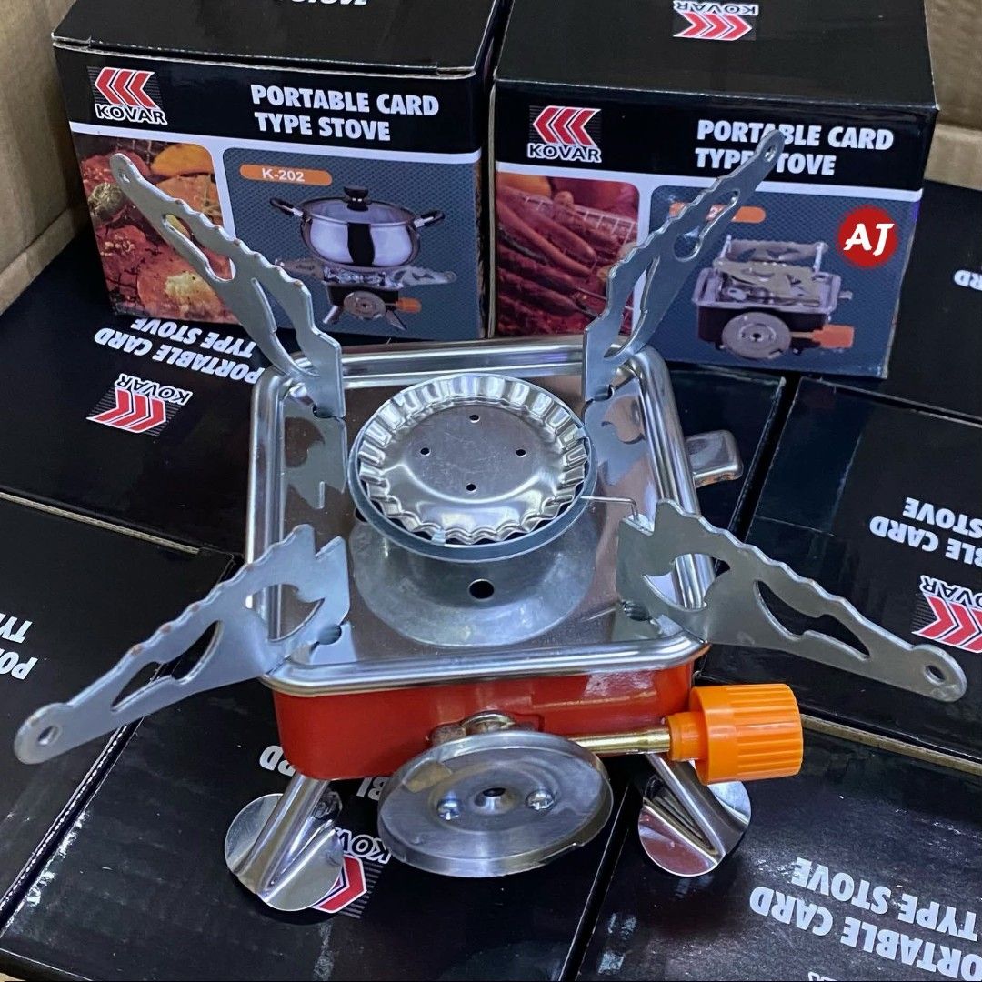 Portable Card Type Stove (Category: Cookware & Accessories) located in Manila. Submitted by yzlshop (Listing ID 1424896190, Image 1). Description: Kovar portable card type stove, model K-202. It is a compact, foldable stove with a red base and silver supports. The stove has an orange control knob and a silver burner. The stove comes in its original box..