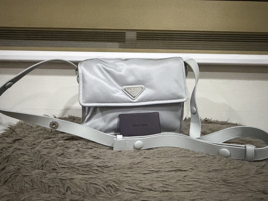 Prada Nylon Bag (Category: Luxury Bags & Wallets) located in San Mateo. Submitted by my_annedorable_preloved (Listing ID 1425000313, Image 2). Description: Used once Gray in actual color In silver hardware 22 cm.