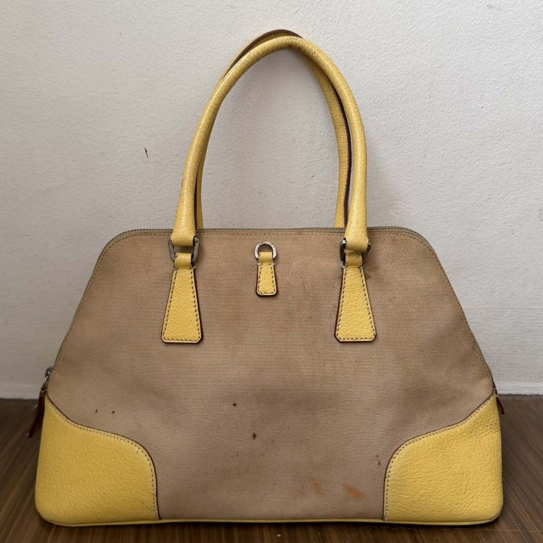 PRE OWNED AUTHENTIC PRADA VINTAGE CANVAS BAG (Category: Luxury Bags & Wallets) located in Paranaque City. Submitted by Glamfahd (Listing ID 1424911244, Image 3). Description: Pre Owned Authentic PRADA Bag Inclusion/s: None Condition Well Used condition Marks on exterior Marks on interior Dirt on exterior Bag is really a great buy! Please manage your expectations as you are buying an authentic second hand item at a fraction of the cost.