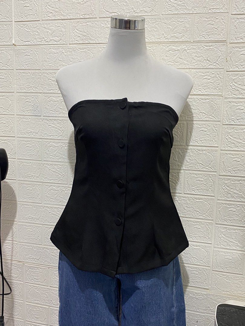 SHEIN Black Tube Top with Buttons (Category: Others Tops) located in Manila. Submitted by anneeem (Listing ID 1424918372, Image 1). Description: - Size Large on Tag (reco for semi-large only) - Black tube top - Button-down design - Fitted silhouette - Peplum hem - Elastic back for secure fit - Dress up or down.