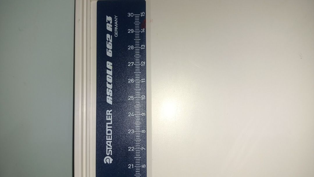 Staedtler A3 Drawing Board (Category: Stationery & School Supplies) located in Munoz. Submitted by larryc1212 (Listing ID 1424987427, Image 2). Description: Staedtler A3 drawing board with a built-in ruler. The board is white with a blue ruler along the side. The ruler has markings in centimeters. The board is designed for precise drawing and drafting. It is suitable for students, artists, and professionals. Item may include some scratches due to
