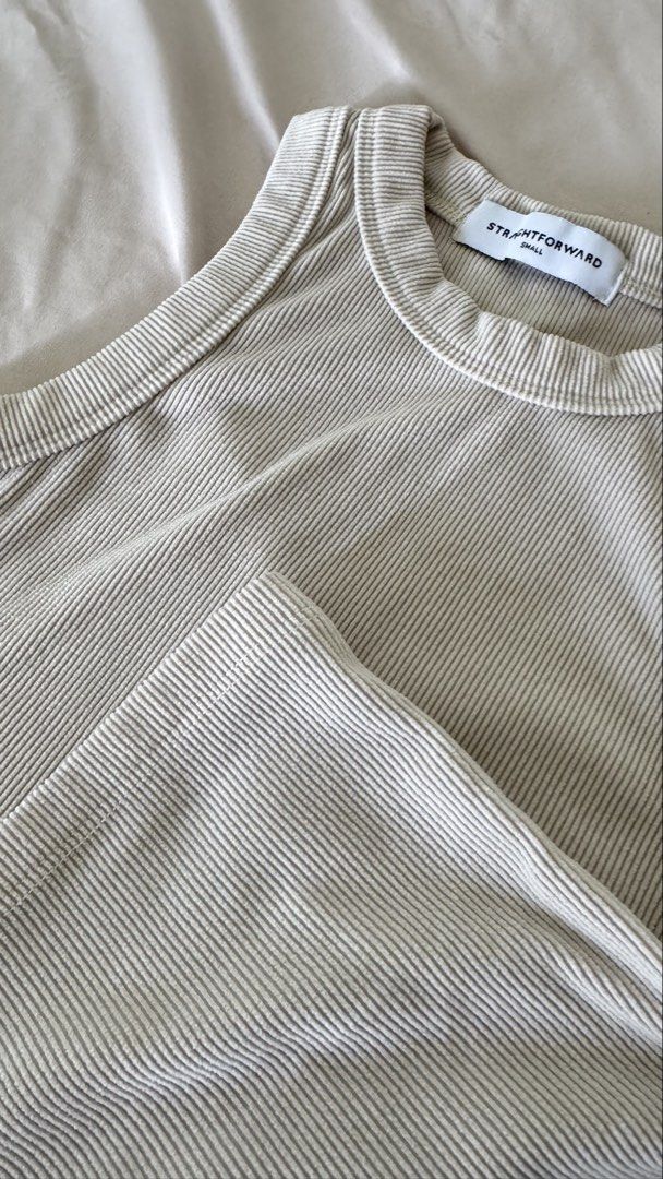 Straightforward Aesthete Tank Top - KW Ivory (Category: Sleeveless) located in Quezon City. Submitted by jericagarcia (Listing ID 1424930997, Image 3). Description: Used, but not abused. Fabric is of good knitwind fabric quality (see photo). Stretchable and slightly cropped top. Color: Beige .