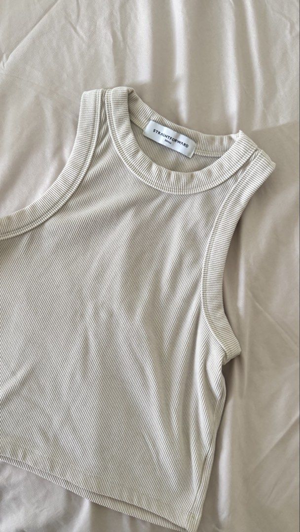 Straightforward Aesthete Tank Top - KW Ivory (Category: Sleeveless) located in Quezon City. Submitted by jericagarcia (Listing ID 1424930997, Image 1). Description: Used, but not abused. Fabric is of good knitwind fabric quality (see photo). Stretchable and slightly cropped top. Color: Beige .