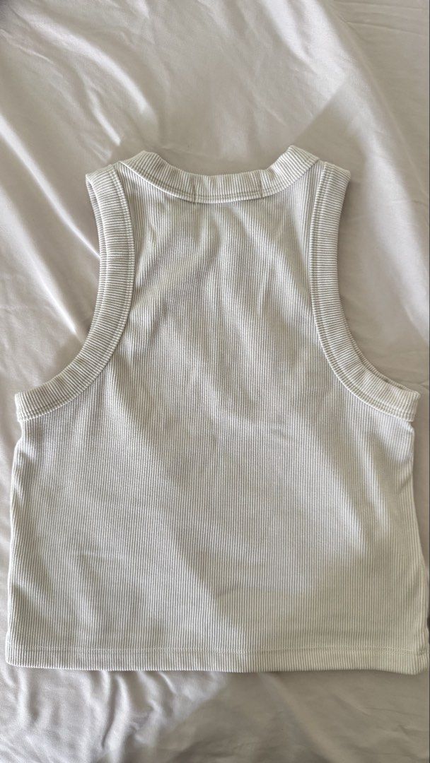 Straightforward Aesthete Tank Top - KW Ivory (Category: Sleeveless) located in Quezon City. Submitted by jericagarcia (Listing ID 1424930997, Image 2). Description: Used, but not abused. Fabric is of good knitwind fabric quality (see photo). Stretchable and slightly cropped top. Color: Beige .