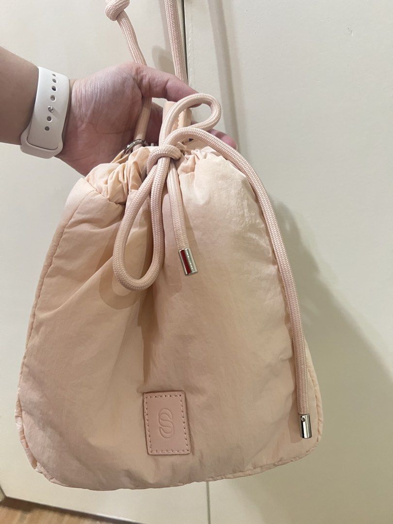 STRAIGHTFORWARD Pink peach tie body shoulder bag (Category: Cross-body Bags) located in Quezon City. Submitted by miareese (Listing ID 1424986196, Image 1). Description: Used once Guaranteed original SRP: 1,500 If you’re gonna buy both pink and green, price is 1,500 for both..
