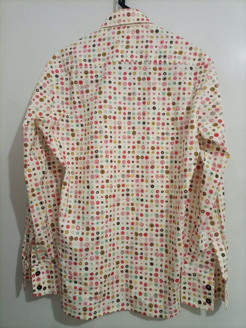 Strangely Normal Polka Dot Long Sleeve Shirt - Medium (Category: Formal Shirts) located in Bacoor. Submitted by imshining_23 (Listing ID 1424980387, Image 3). Description: Stylish long-sleeved shirt from Strangely Normal. Features a unique polka dot pattern in various colors on a cream background. It has a button-down closure and a classic collar. The shirt is a size Medium. Perfect for adding a pop of color to your wardrobe..
