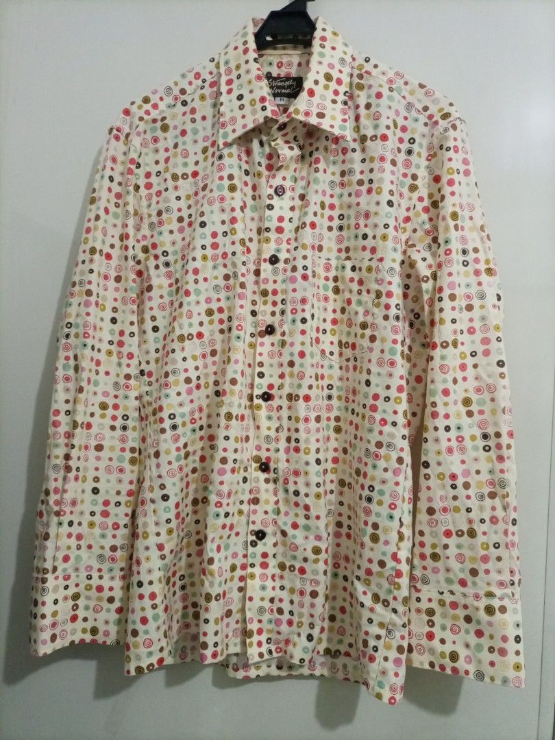 Strangely Normal Polka Dot Long Sleeve Shirt - Medium (Category: Formal Shirts) located in Bacoor. Submitted by imshining_23 (Listing ID 1424980387, Image 2). Description: Stylish long-sleeved shirt from Strangely Normal. Features a unique polka dot pattern in various colors on a cream background. It has a button-down closure and a classic collar. The shirt is a size Medium. Perfect for adding a pop of color to your wardrobe..