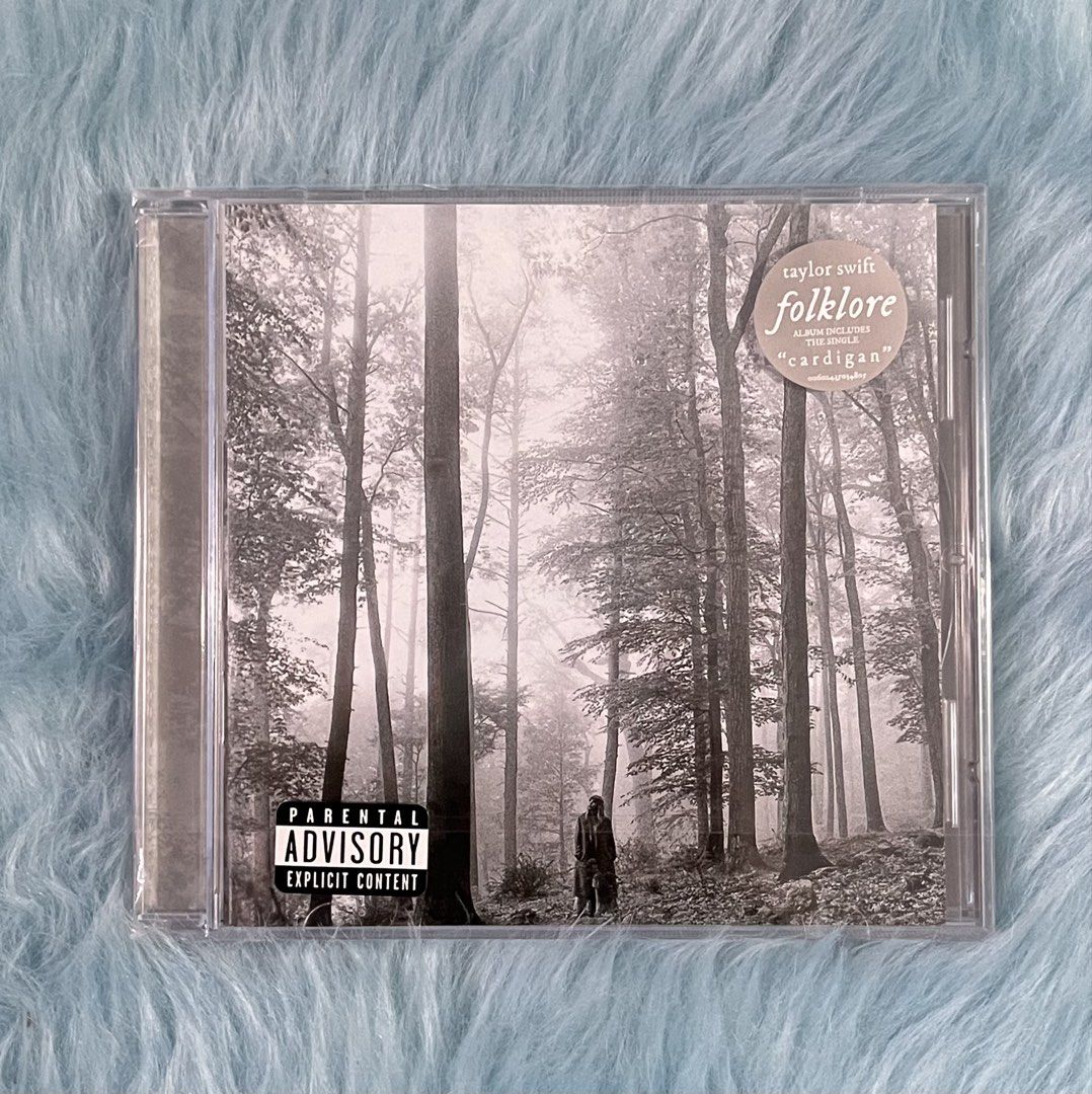 Taylor Swift Folklore CD (Category: CDs & DVDs) located in Dasmarinas. Submitted by ohsnaprecords (Listing ID 1424929674, Image 1). Description: CD of Taylor Swift's album "Folklore". The album cover features a black and white image of a forest. The back of the CD case shows the tracklist and album details. It includes the song "cardigan". Mode of Payment: Gcash/Paypal Mode of Delivery: JNT/GGX Shoulder po ng buyer ang shipping fee. Interested? D