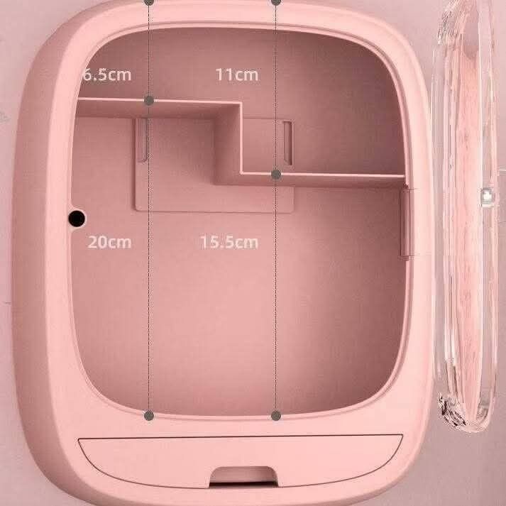 Wall-Mounted Cosmetic Organizer (Category: Makeup) located in Quezon City. Submitted by anghies_shop (Listing ID 1425055184, Image 1). Description: Pink wall-mounted cosmetic organizer features multiple compartments and a drawer for storing beauty products. It has a clear door for easy visibility and a compact design. The organizer's dimensions are approximately 20cm in height, 15.5cm in width, and 11cm in depth. It includes shelves and a drawer 