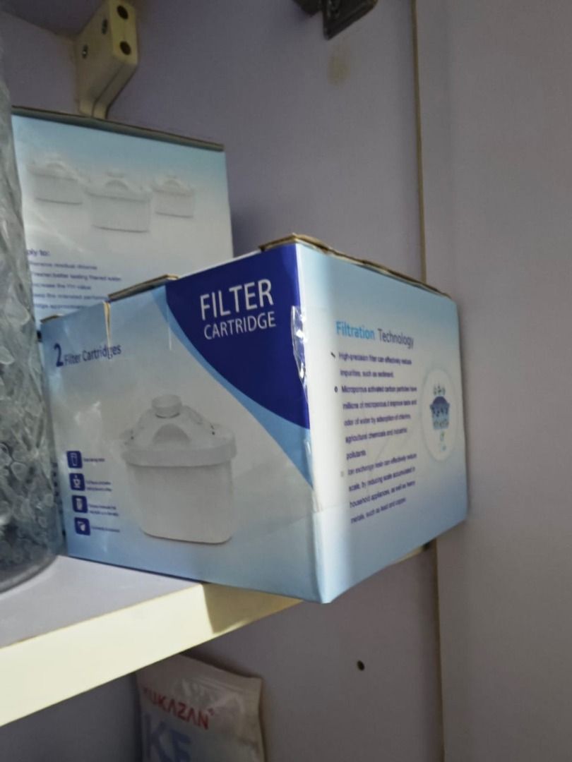 Water Filter Cartridge (Category: Pitchers & Dispensers) located in Taguig. Submitted by boldowl.1ea607 (Listing ID 1424924599, Image 2). Description: Filter cartridge. It is designed to filter water. The box indicates it uses filtration technology to remove impurities. It also mentions the use of activated carbon particles and ion exchange resins. The box contains 2 filter cartridges. 5 boxes of cartridges..