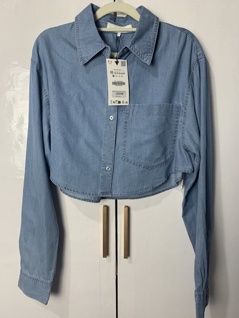Zara Cropped Denim Shirt (Category: Longsleeves) located in Pasay City. Submitted by ella8922 (Listing ID 1425006299, Image 3). Description: - Zara Cropped Denim Shirt - Size: XS - Condition: Brand new with tags - Design: Cropped style - Material: Soft Denim - Color: Light wash.