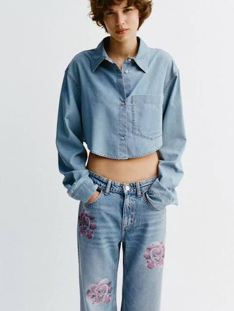 Zara Cropped Denim Shirt (Category: Longsleeves) located in Pasay City. Submitted by ella8922 (Listing ID 1425006299, Image 1). Description: - Zara Cropped Denim Shirt - Size: XS - Condition: Brand new with tags - Design: Cropped style - Material: Soft Denim - Color: Light wash.
