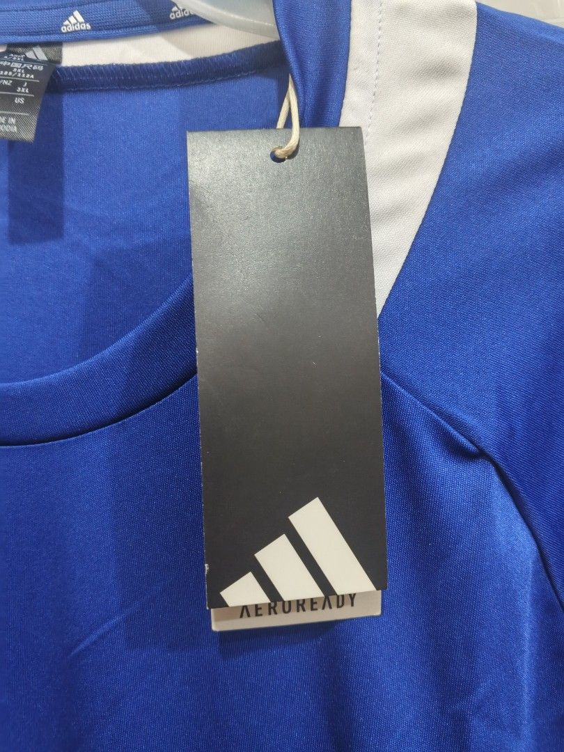 Adidas AEROREADY Blue Jersey (Category: Activewear) located in Bacoor. Submitted by nmcave (Listing ID 1425076919, Image 3). Description: Adidas jersey is blue with white accents. It features the Adidas logo on the front and AEROREADY technology. The jersey has short sleeves and a crew neck. SIZE XXXL EQUIVALENT TO 5XL PHILIPPINES SIZING.