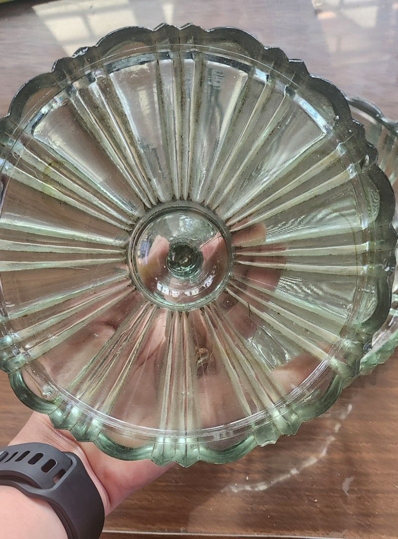 Antique Glass Candy Dish with Lid (Category: Other Kitchenware & Tableware) located in Manila. Submitted by maybelle00 (Listing ID 1425161505, Image 3). Description: Elegant antique glass candy dish with a lid. Features a unique design with a fluted pattern on the lid and a decorative base. The dish is made of clear glass with a slight green tint. Perfect for displaying candies or small items. A beautiful vintage piece to add to your collection..