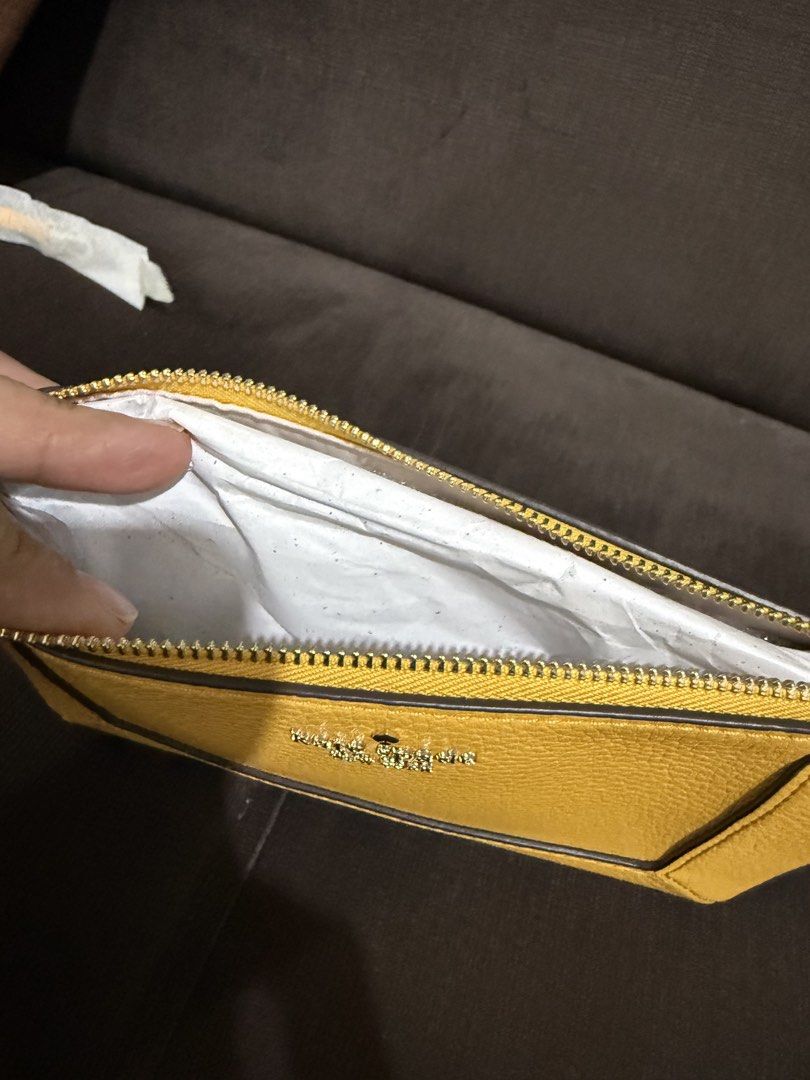 Authentic Kate Spade Lena Convertible Wristlet -Daffodil (Category: Luxury Bags & Wallets) located in Quezon City. Submitted by andanel16 (Listing ID 1425206553, Image 2). Description: Authentic Kate Spade Lena Convertible Wristlet Color: Daffodil Condition: Brand New Price: ₱4,500 • Elegant and versatile • Perfect for everyday errands or casual outings • Fits phone, cards, cash, and small essentials 100% Original From US When worn photos credit 