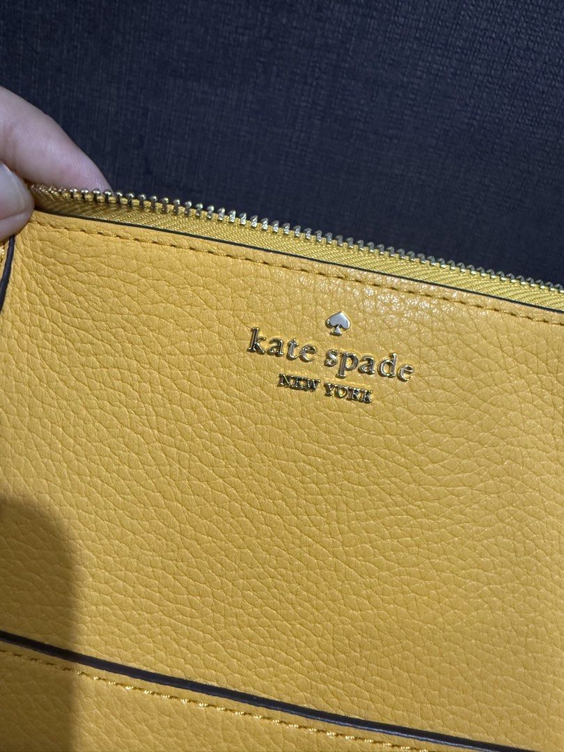 Authentic Kate Spade Lena Convertible Wristlet -Daffodil (Category: Luxury Bags & Wallets) located in Quezon City. Submitted by andanel16 (Listing ID 1425206553, Image 3). Description: Authentic Kate Spade Lena Convertible Wristlet Color: Daffodil Condition: Brand New Price: ₱4,500 • Elegant and versatile • Perfect for everyday errands or casual outings • Fits phone, cards, cash, and small essentials 100% Original From US When worn photos credit 