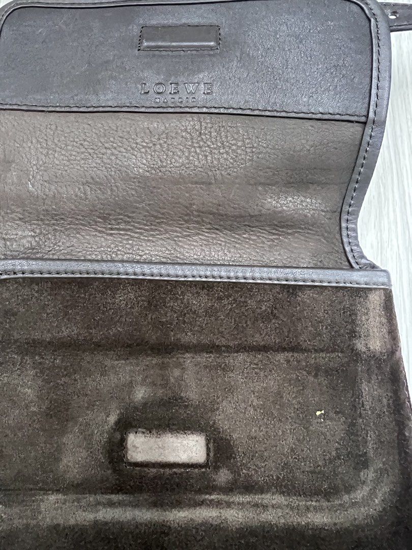 Authentic Loewe Madrid Suede Shoulder Bag (Category: Luxury Bags & Wallets) located in Cagayan de Oro. Submitted by riggstuffs (Listing ID 1425120234, Image 3). Description: ➡️ Guaranteed Authentic Loewe Madrid shoulder bag features a suede exterior with a leather flap and trim. ➡️ Made in Spain ➡️ With Code ➡️ The bag has a long adjustable strap and a snap closure. ➡️ Interior is lined with a soft material. ➡️ The Loewe logo is visible on the fr