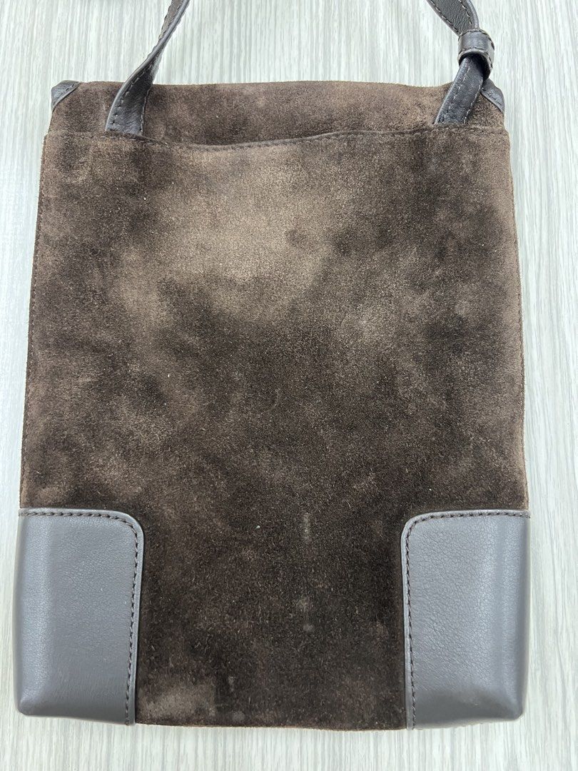 Authentic Loewe Madrid Suede Shoulder Bag (Category: Luxury Bags & Wallets) located in Cagayan de Oro. Submitted by riggstuffs (Listing ID 1425120234, Image 2). Description: ➡️ Guaranteed Authentic Loewe Madrid shoulder bag features a suede exterior with a leather flap and trim. ➡️ Made in Spain ➡️ With Code ➡️ The bag has a long adjustable strap and a snap closure. ➡️ Interior is lined with a soft material. ➡️ The Loewe logo is visible on the fr