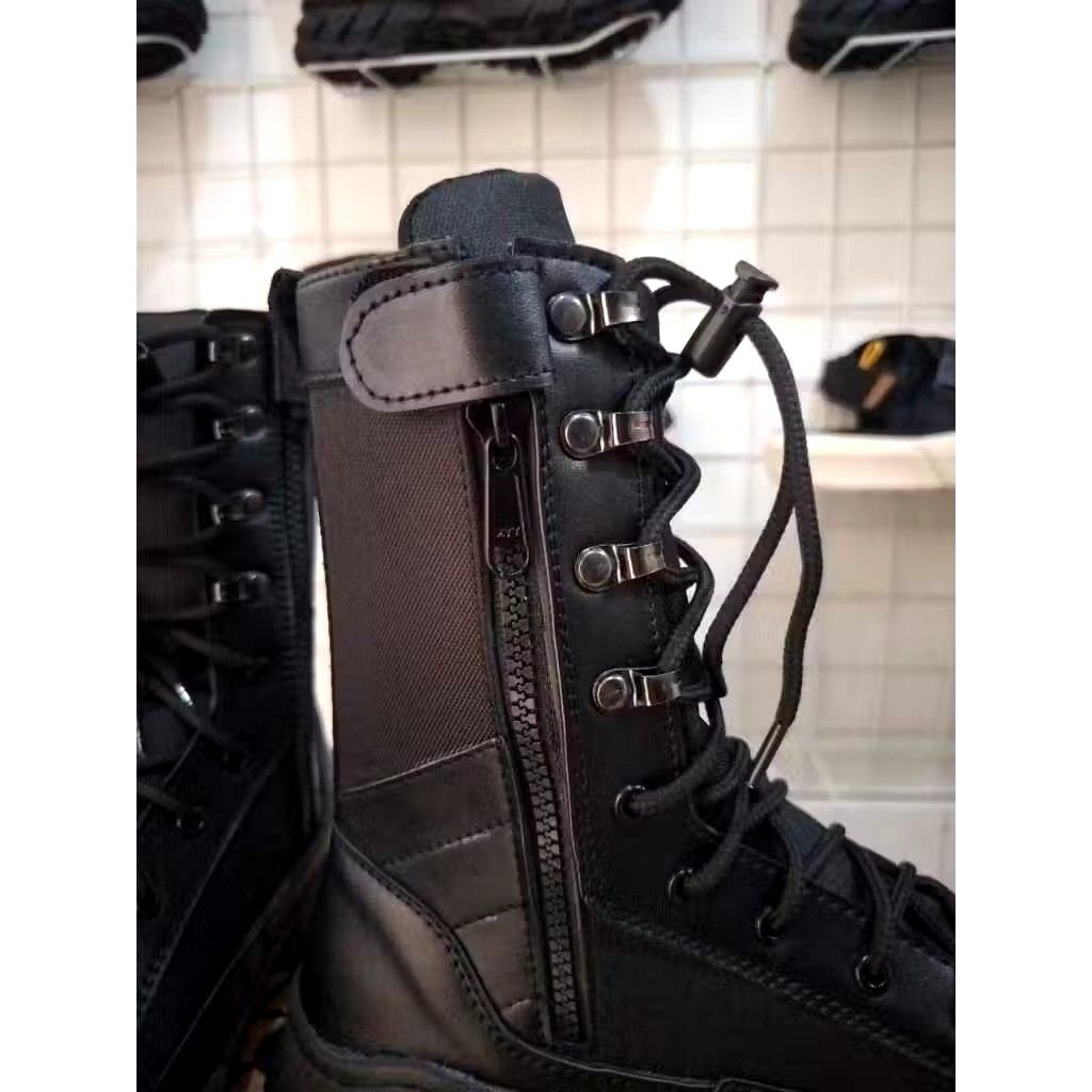 Black Combat Boots (Category: Boots) located in Marikina City. Submitted by tattooednurse. (Listing ID 1425125279, Image 2). Description: Black combat boots with laces and a side zipper. The boots have a thick sole and a high-top design. The brand name "Gilboy" is visible on the box. The boots appear to be made of leather or a similar material. They are suitable for various outdoor activities..