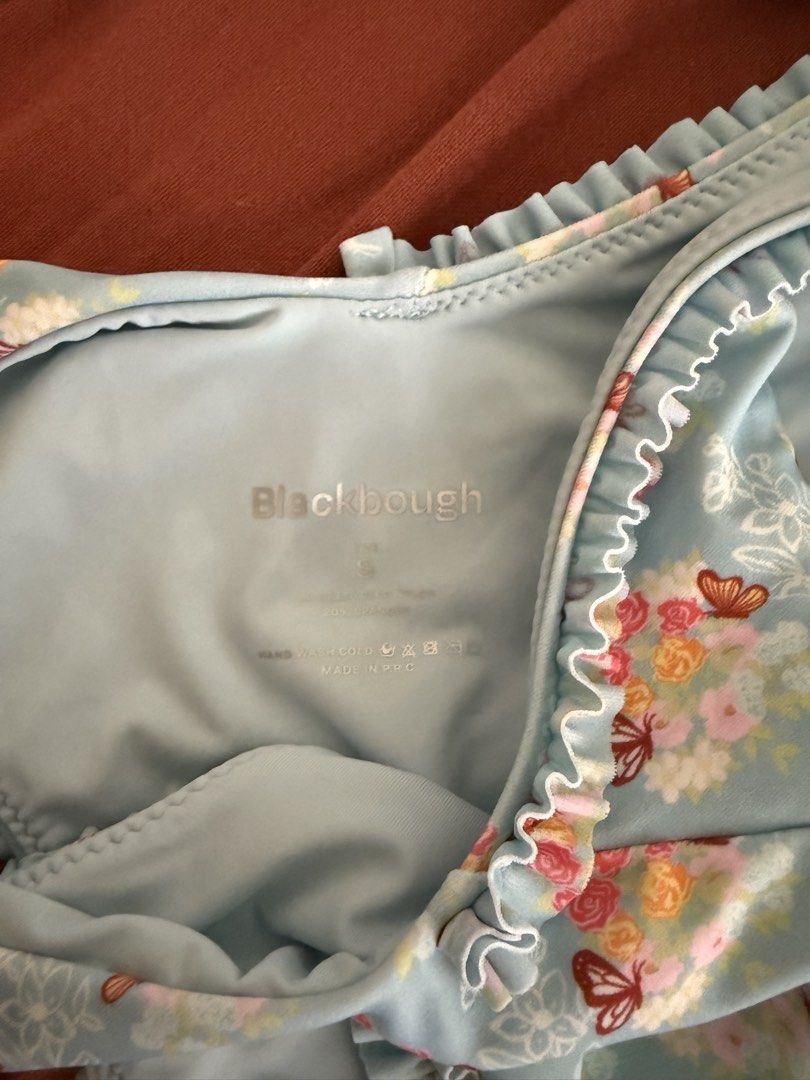 Blackbough Swim Floral Bikini Set (Category: Bikinis & Swimsuits) located in Mandaluyong City. Submitted by ndclutters (Listing ID 1425208207, Image 2). Description: Blackbough Swim bikini set featuring a blue floral print with butterfly accents. The set includes a top and a bottom with ruffle detailing. The bottom is a size S. The bikini is light blue in color..