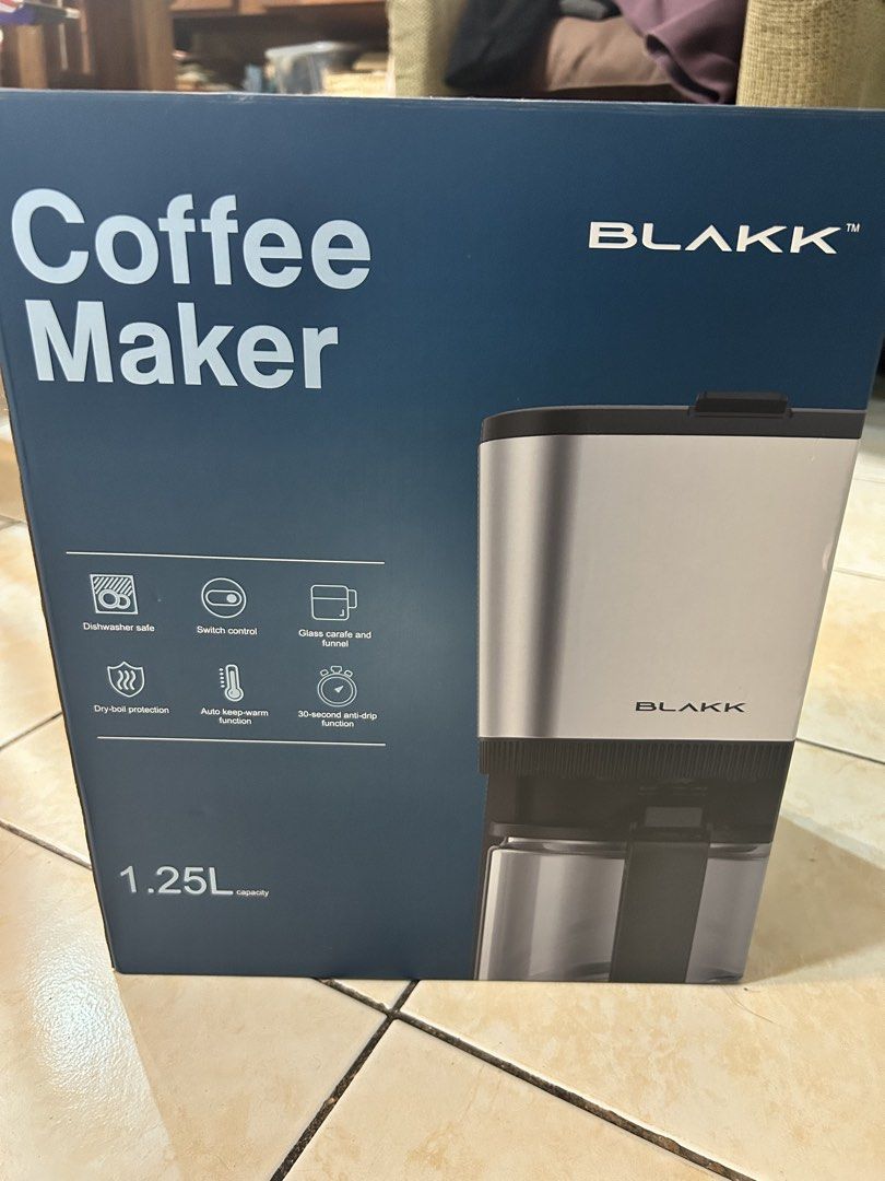 Blakk Coffee Maker 1.25L (Category: Coffee Machines & Makers) located in Pasig City. Submitted by timecheckmanila (Listing ID 1425102255, Image 1). Description: Blakk coffee maker has a 1.25L capacity and can make up to 10 cups. It features a 30-second anti-drip function, auto keep-warm function, and a glass carafe with a funnel. It is dishwasher safe and has dry-boil protection. The model number is KXB111CM..