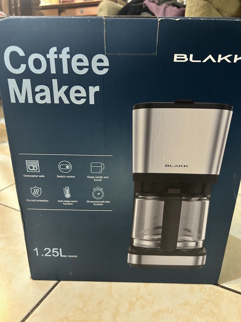 Blakk Coffee Maker 1.25L (Category: Coffee Machines & Makers) located in Pasig City. Submitted by timecheckmanila (Listing ID 1425102255, Image 3). Description: Blakk coffee maker has a 1.25L capacity and can make up to 10 cups. It features a 30-second anti-drip function, auto keep-warm function, and a glass carafe with a funnel. It is dishwasher safe and has dry-boil protection. The model number is KXB111CM..