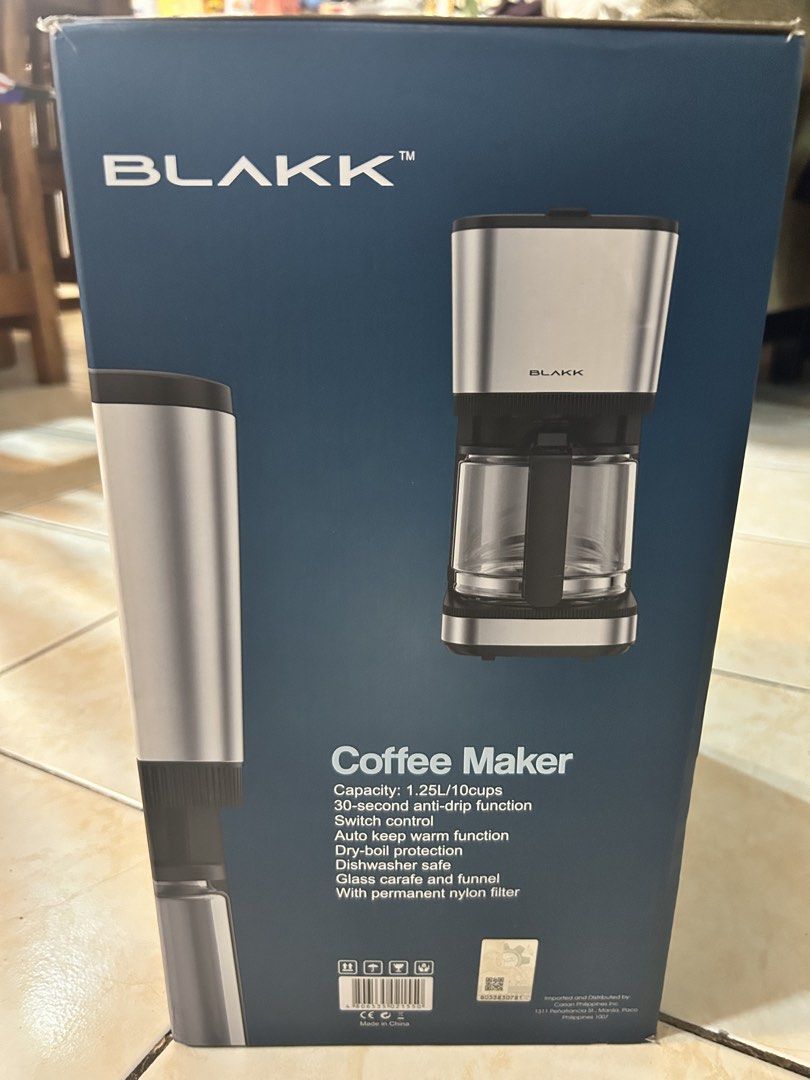 Blakk Coffee Maker 1.25L (Category: Coffee Machines & Makers) located in Pasig City. Submitted by timecheckmanila (Listing ID 1425102255, Image 2). Description: Blakk coffee maker has a 1.25L capacity and can make up to 10 cups. It features a 30-second anti-drip function, auto keep-warm function, and a glass carafe with a funnel. It is dishwasher safe and has dry-boil protection. The model number is KXB111CM..