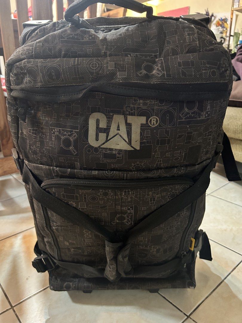 CAT Rolling Luggage (Category: Luggage) located in Pasig City. Submitted by timecheckmanila (Listing ID 1425104428, Image 1). Description: Durable CAT rolling luggage with a unique patterned design. Features multiple compartments and straps for secure packing. Includes a handle and wheels for easy transport. The luggage has a CAT logo on the front. Selling cheap. WYSIWYG.