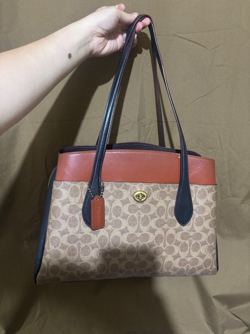 Coach Lora Caryall in Tan (Category: Luxury Bags & Wallets) located in Pasay City. Submitted by _justjoules (Listing ID 1425241258, Image 1). Description: Authentic: Came from Japan Best office bag Handle: 8'5 long Best fits 12' laptop, 13' might be snug L: 14 1/4 x H: 25 x W: 6 1/4 Polished pebbled leather, multi-function pockets Retails for $395 (Some selling it for ₱8k and up) Please message me for flaws Tag says made in PH Slightly negotiable