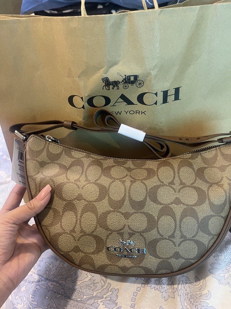 Original Coach Signature Crescent Bag (Category: Luxury Bags & Wallets) located in Bulacan. Submitted by butterflies21 (Listing ID 1425141270, Image 2). Description: Original Authentic For Sale Own Preloved Coach Hobo Bag With paper bag and carecard Message for sure buyer only. Message for more pictures.