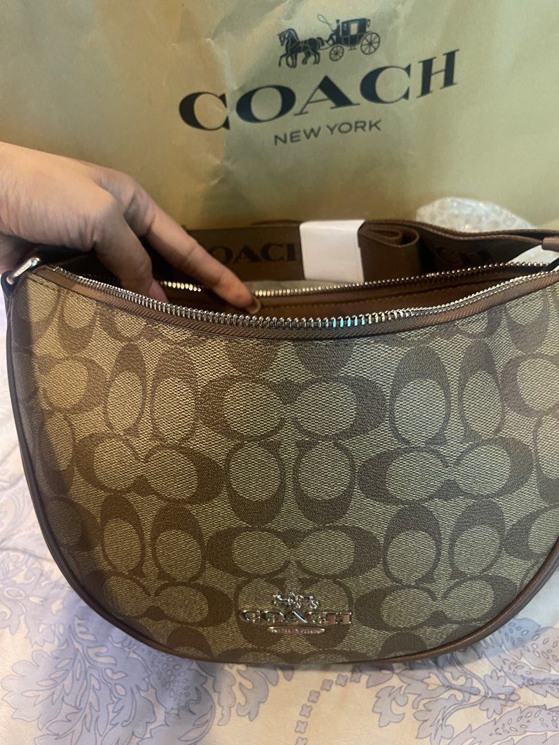 Original Coach Signature Crescent Bag (Category: Luxury Bags & Wallets) located in Bulacan. Submitted by butterflies21 (Listing ID 1425141270, Image 3). Description: Original Authentic For Sale Own Preloved Coach Hobo Bag With paper bag and carecard Message for sure buyer only. Message for more pictures.