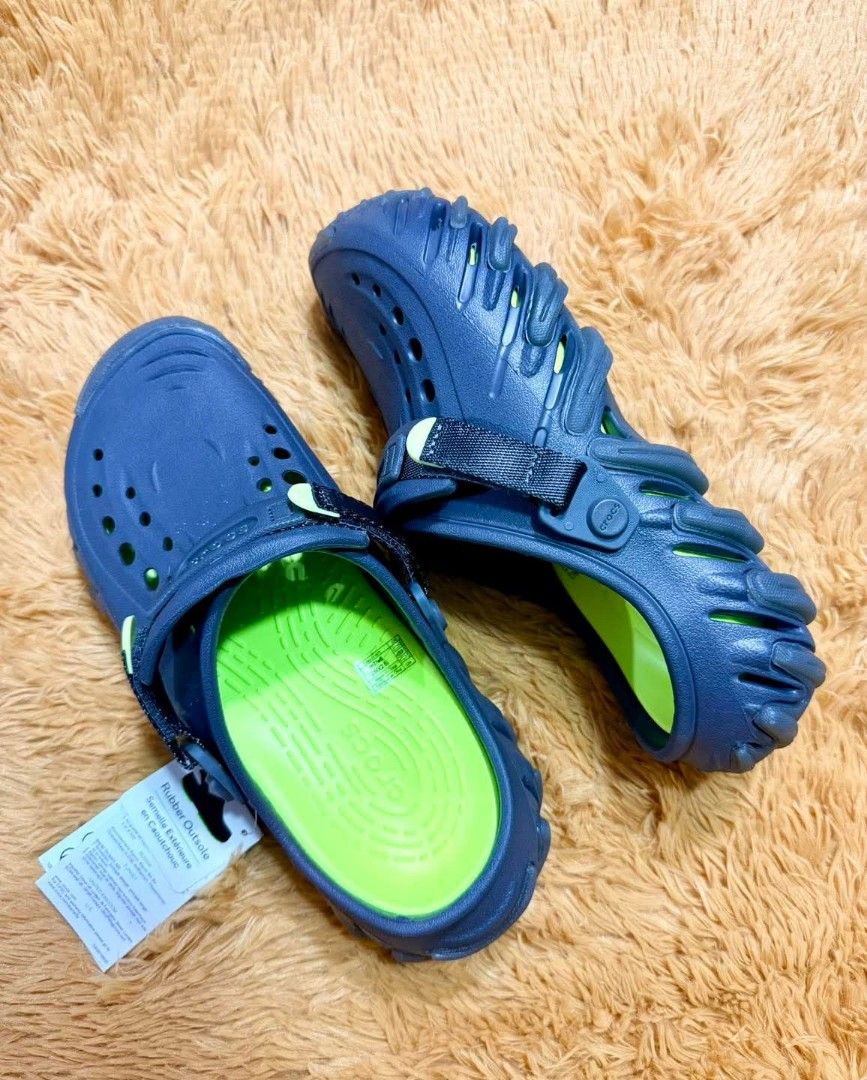 Crocs Echo Gum Sandals (Category: Flats & Sandals) located in Manila. Submitted by munchkinsweet (Listing ID 1425100462, Image 1). Description: These Crocs sandals feature a unique design with a rubber outsole. They have a strap for a secure fit and are available in multiple colors. The sandals have the Crocs logo on the footbed. They appear to be new with tags attached..