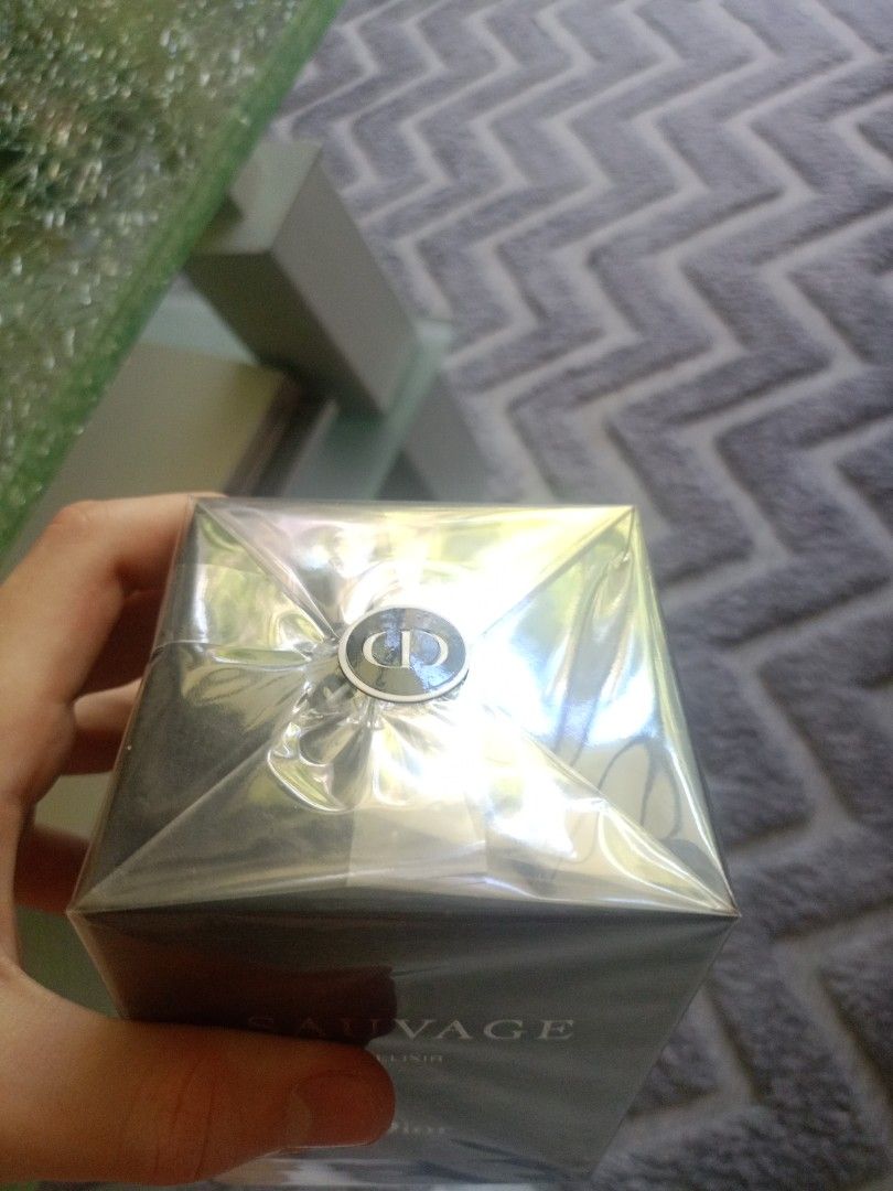 Dior Sauvage Elixir (Category: Fragrance & Deodorants) located in Cebu City. Submitted by cedric- (Listing ID 1425080904, Image 2). Description: Sealed bottle of Dior Sauvage Elixir. The box is black with silver lettering. The top of the box has a Dior logo. The barcode is visible on the bottom of the box..