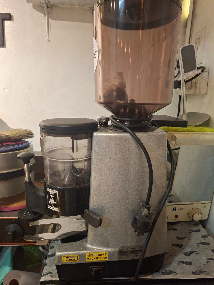 Eureka Professional Coffee Grinder (Category: Coffee Machines & Makers) located in Caloocan City. Submitted by jethroww.gascon17 (Listing ID 1425108516, Image 2). Description: For Sale Eureka Mondial Commercial professional Coffee bar Grinder with doser 450grams and tamper original came from italy 2kg hopper 65mm flar burr good for espresso, pour over, brewing sizes. 1330rpm 220v outlet 280watts issue: need to rewind motor to more faster grinding