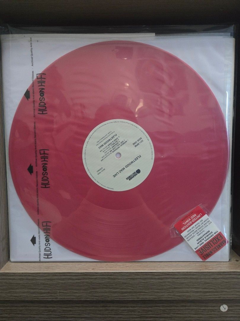 Fleetwood Mac Live Red Vinyl (Category: Vinyls) located in Makati City. Submitted by lizkw (Listing ID 1425110175, Image 2). Description: Fleetwood Mac Live red vinyl record. Limited edition. The record is still sealed in its original packaging. The album cover features a black and white image with the words "Fleetwood Mac Live" printed on the side. The record itself is red..