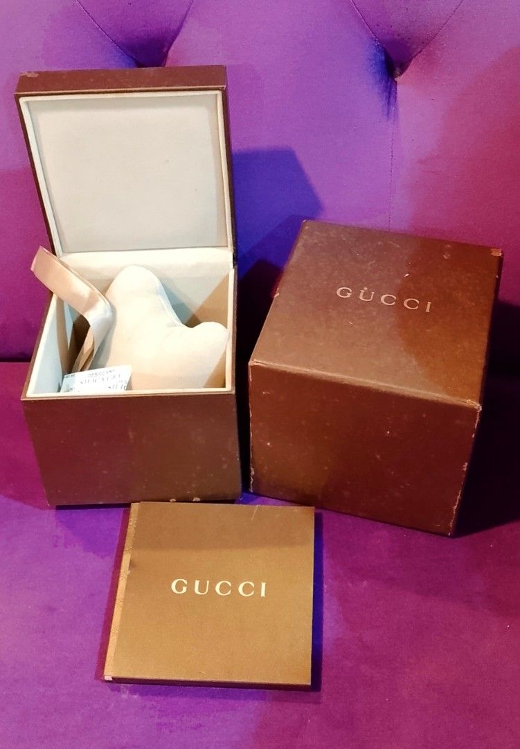 Gucci Watch Box with Accessories (Category: Luxury Watches) located in Cabanatuan. Submitted by miss.maia (Listing ID 1425233241, Image 1). Description: Authentic Gucci watch box set. Includes the outer box, inner box, watch pillow, and booklet. The box is brown with the Gucci logo on the top. The inner box has a beige interior. The booklet is also included. Perfect for storing or gifting a Gucci watch. Nego for sure buyer! add sf.