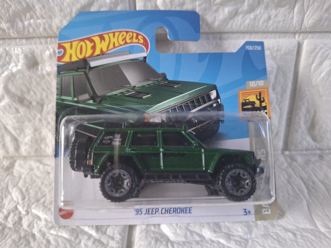 Hot Wheels '95 Jeep Cherokee (Category: Vehicle & Diecast Models) located in Narvacan. Submitted by jigger85_2ndaccount (Listing ID 1425071794, Image 1). Description: Hot Wheels '95 Jeep Cherokee diecast car. It is green and part of the Baja Blazers series, numbered 10/10 and 158/250. The car is still in its original packaging..
