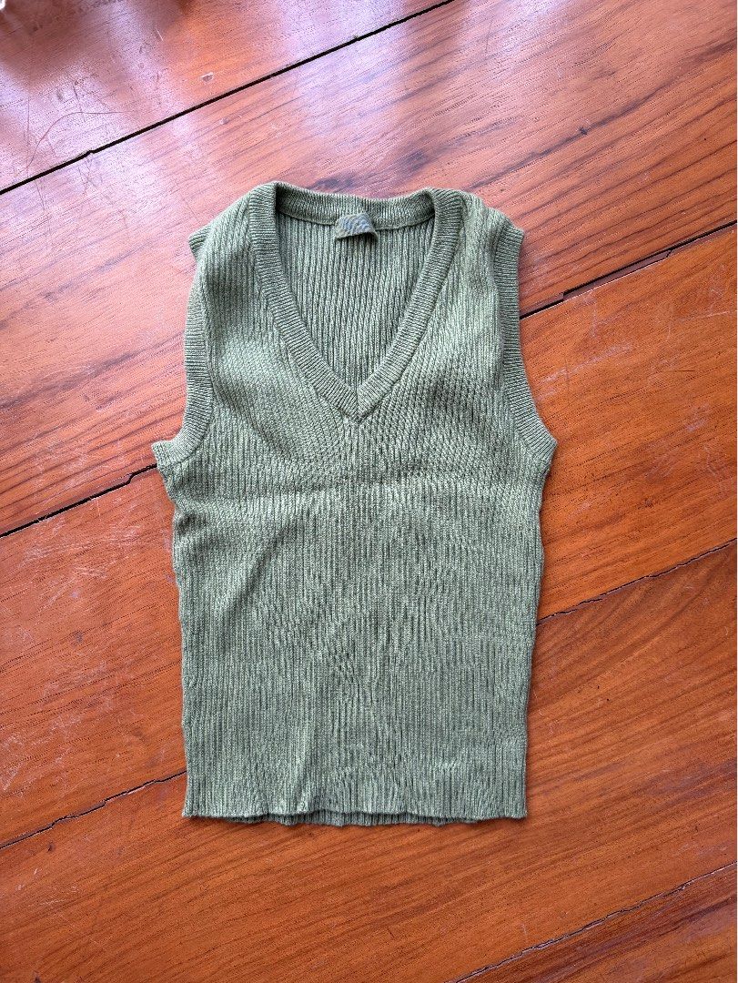 Brandy Melville Green Vest (Category: Blouses) located in Pasig City. Submitted by ninipoonini (Listing ID 1425093146, Image 2). Description: ‼️ 5% off if you buy 2+ items (max: P300 off) ‼️ - So cute I don’t want to give this away - Green color (looks diff in person) - One size only! (Small probably).