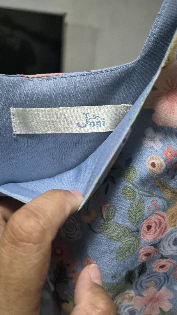 Joni Floral Dress (Category: Dresses) located in Del Monte. Submitted by emem25 (Listing ID 1425201561, Image 2). Description: Beautiful floral dress from Joni. Features a light blue background with a colorful floral pattern. It has puff sleeves and a V-neckline. The dress has a flowy silhouette..