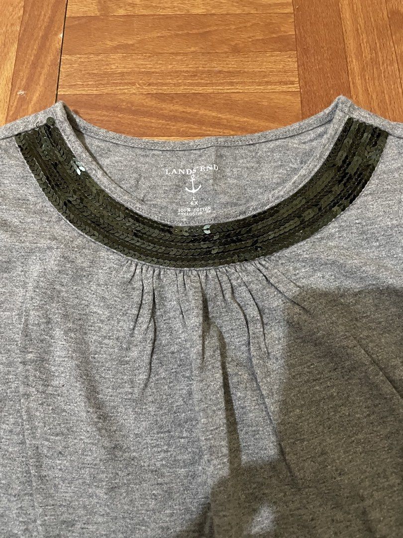 Lands' End Gray Long Sleeve Shirt (Category: Babies & Kids Fashion) located in Cavite. Submitted by HelloAnn_Closet (Listing ID 1425224086, Image 2). Description: Gray long sleeve shirt from Lands' End. Features a round neckline with decorative sequins. Made of 100% cotton. The shirt has a relaxed fit with gathered detailing at the neckline and cuffs..